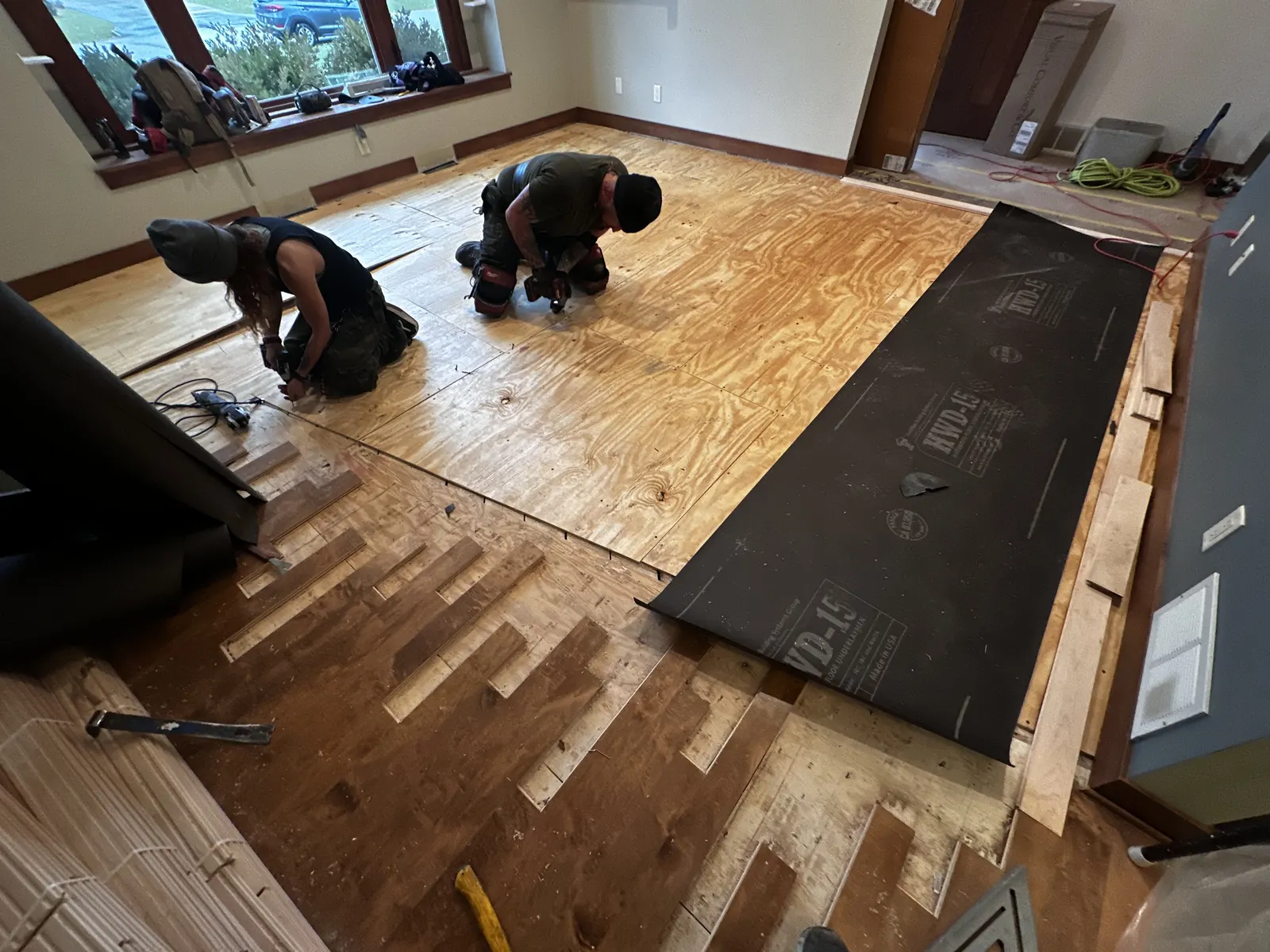 Existing floor cut back and subfloor prepared before new hardwood is installed