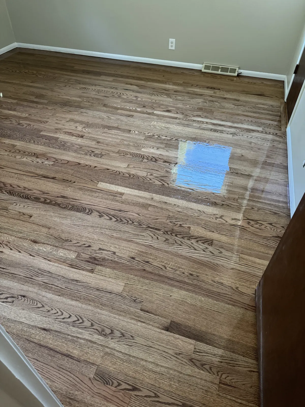 Newly installed and stained hardwood floor in a bedroom, Brookfield, WI