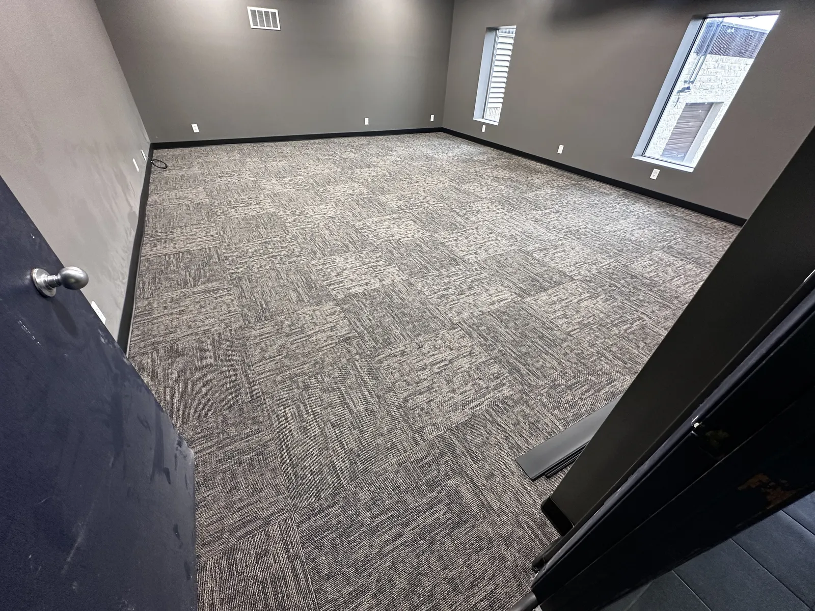 New carpet tile and vinyl base in a commercial room, Southeast Wisconsin