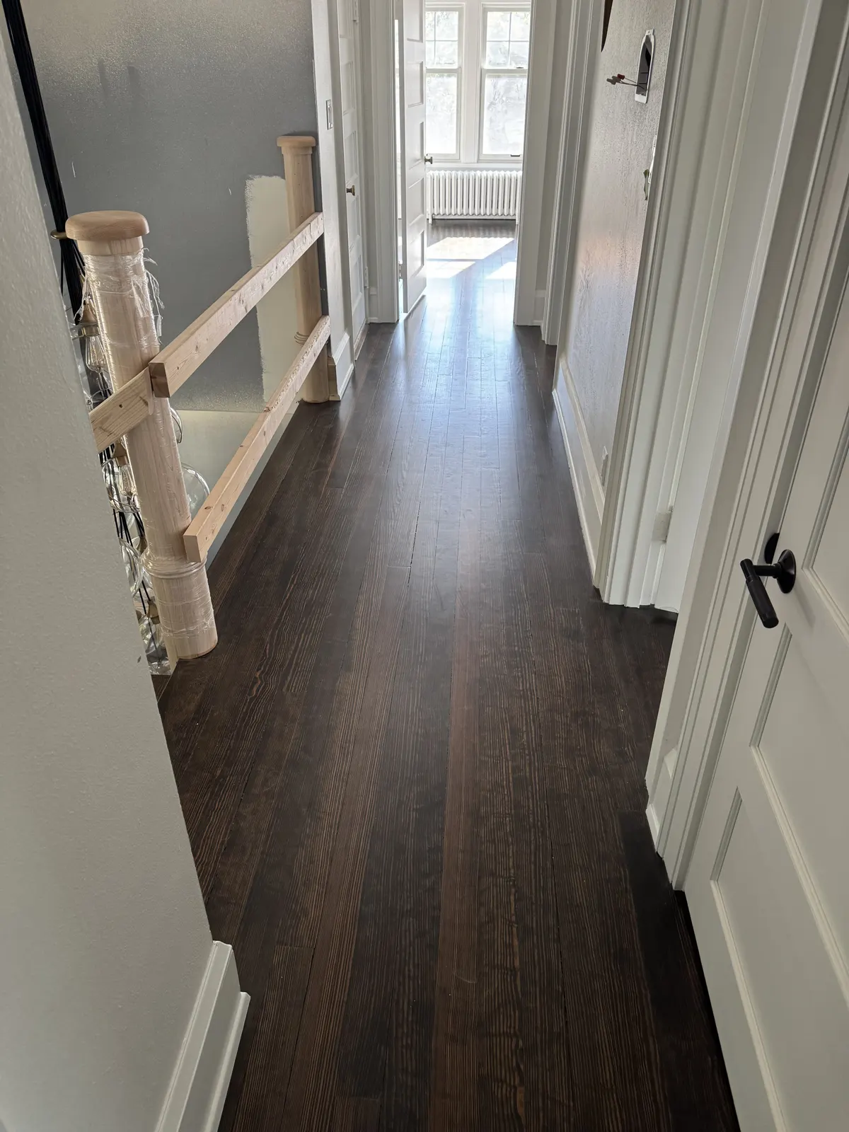 Refinished floor on the second-floor landing of an 1800s Fox Point home