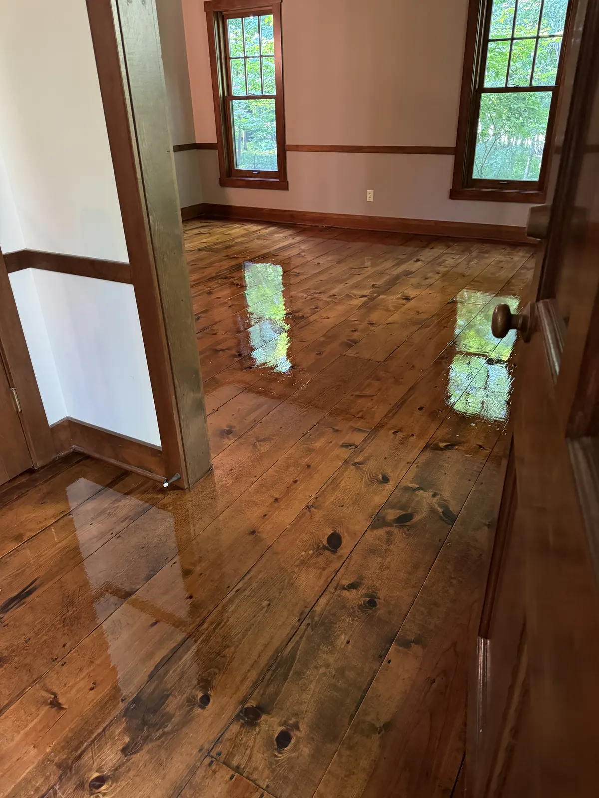 Refinished wide-board pine floor with a glossy finish, Milwaukee, WI