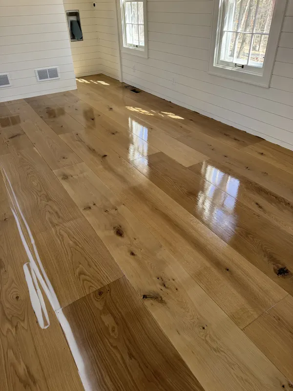Wide-plank white oak floor with a glossy finish in a tiny home, Nashotah, WI