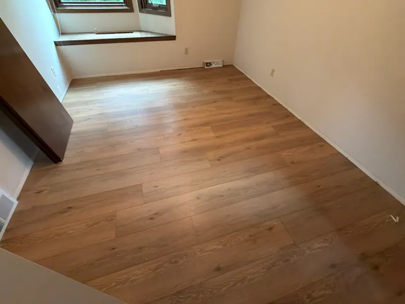 New luxury vinyl plank floor in a room with a bay window, New Berlin, WI