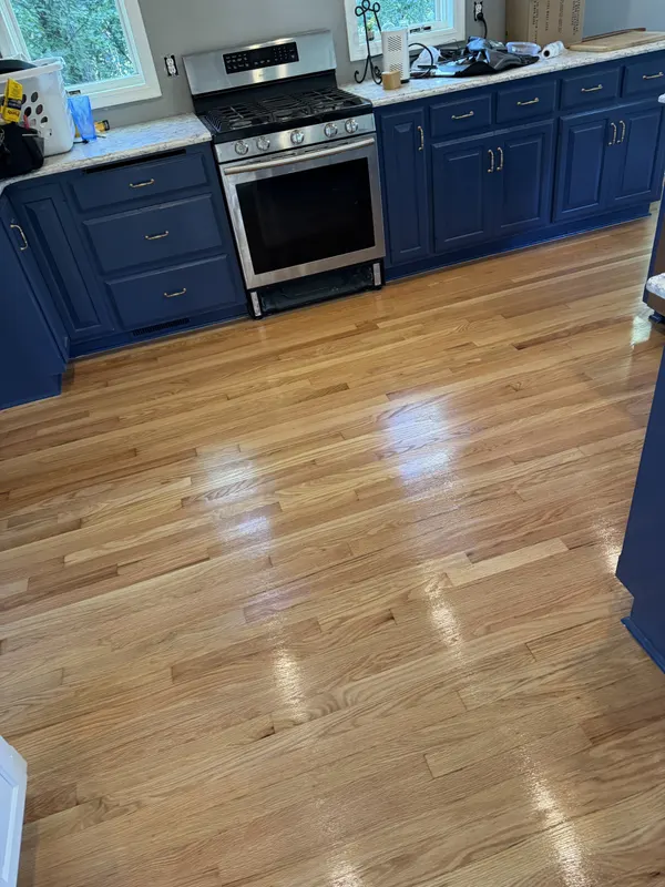 Refinished oak floor in a kitchen with blue cabinets, New Berlin, WI