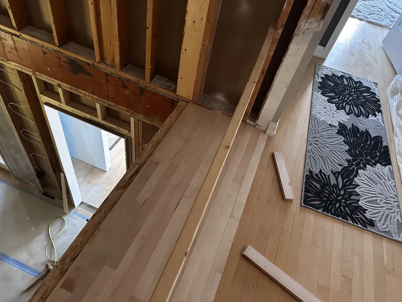 New maple flooring joined to the existing floor in a framed addition, Oconomowoc, WI
