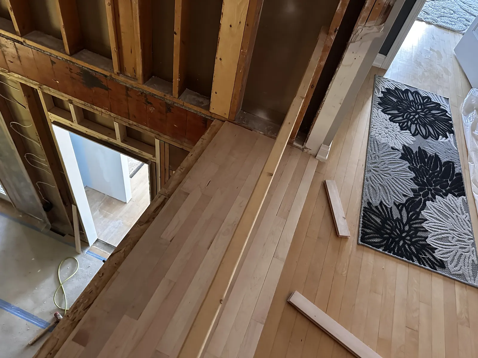 New maple flooring joined to the existing floor in a framed addition, Oconomowoc, WI