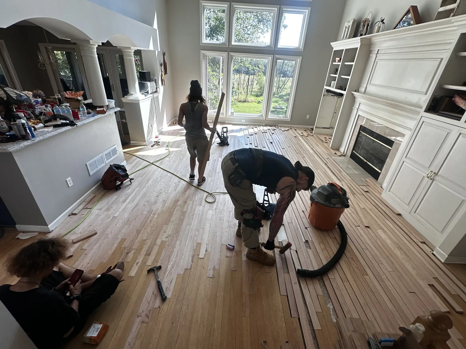 The BBJ crew weaving new hardwood into an existing floor