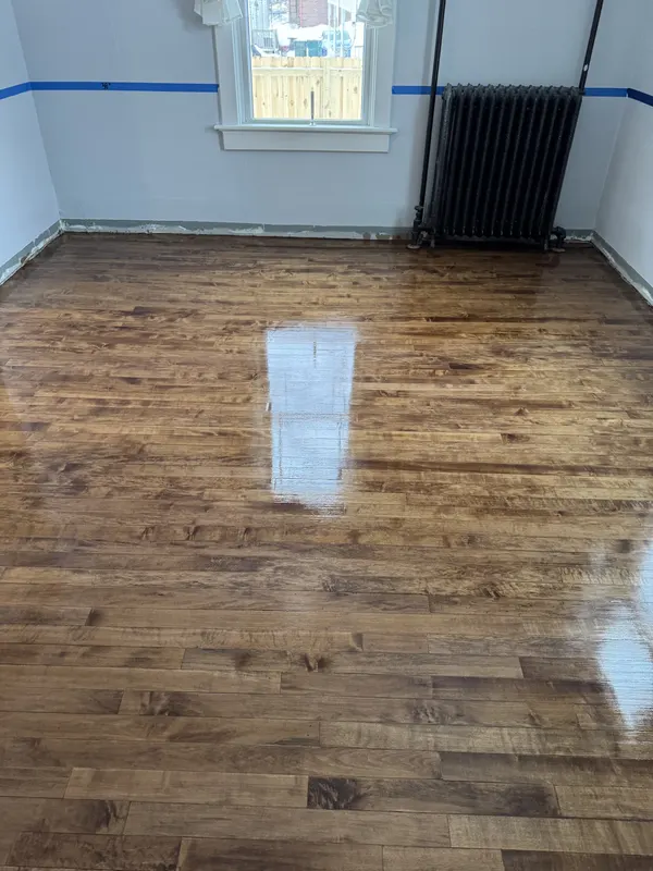 Refinished original maple floor in an old home with a radiator, Richfield, WI